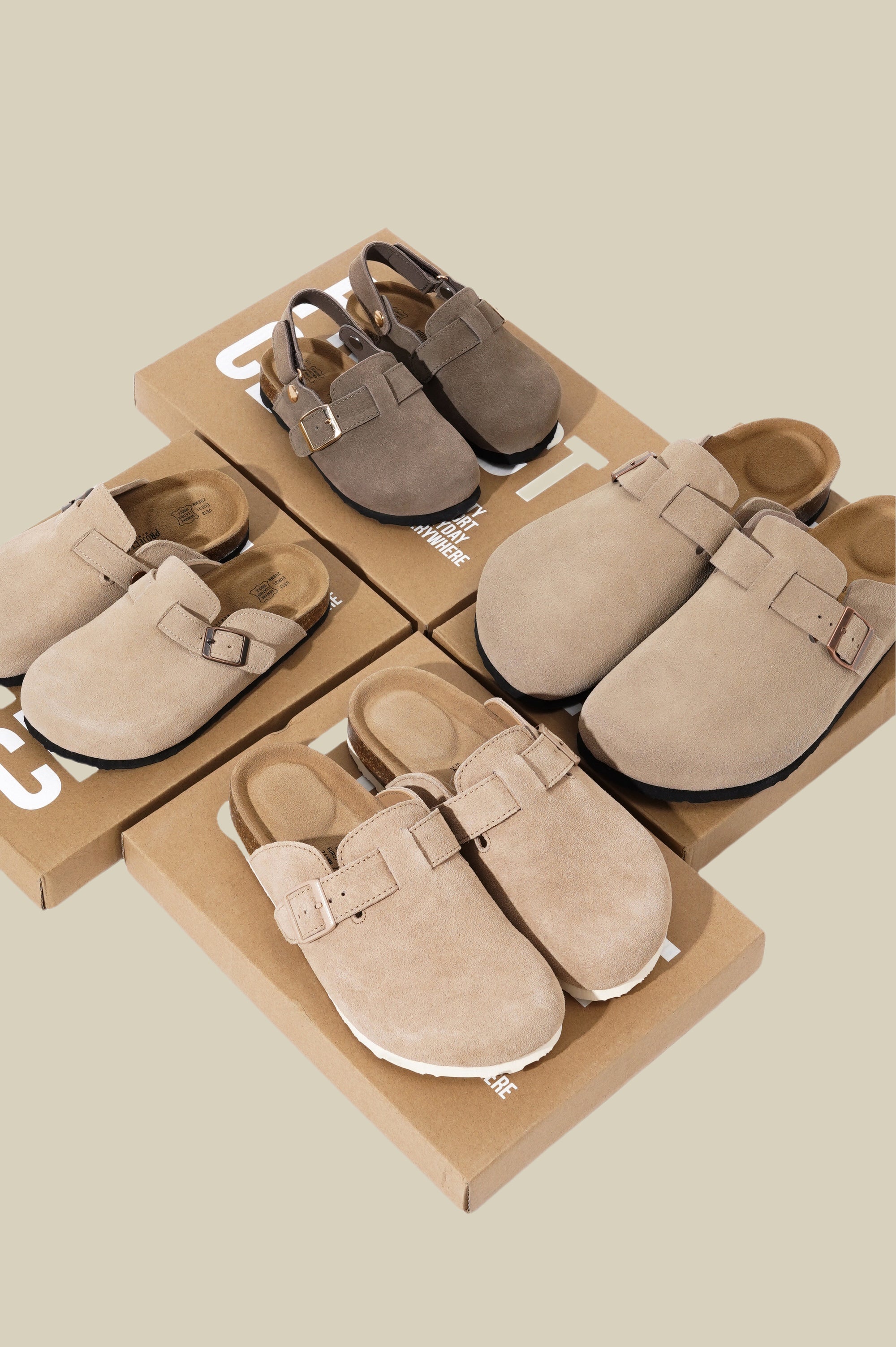 Suede clogs in different styles and colors on brown boxes, emphasizing comfort and style.