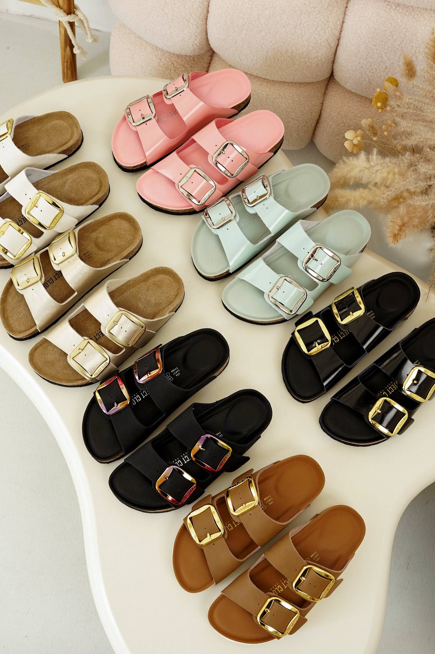 A collection of Project Cloud high-rebound sandals in various colors, featuring soft dual-strap buckles and thick cushioned midsoles for all-day comfort