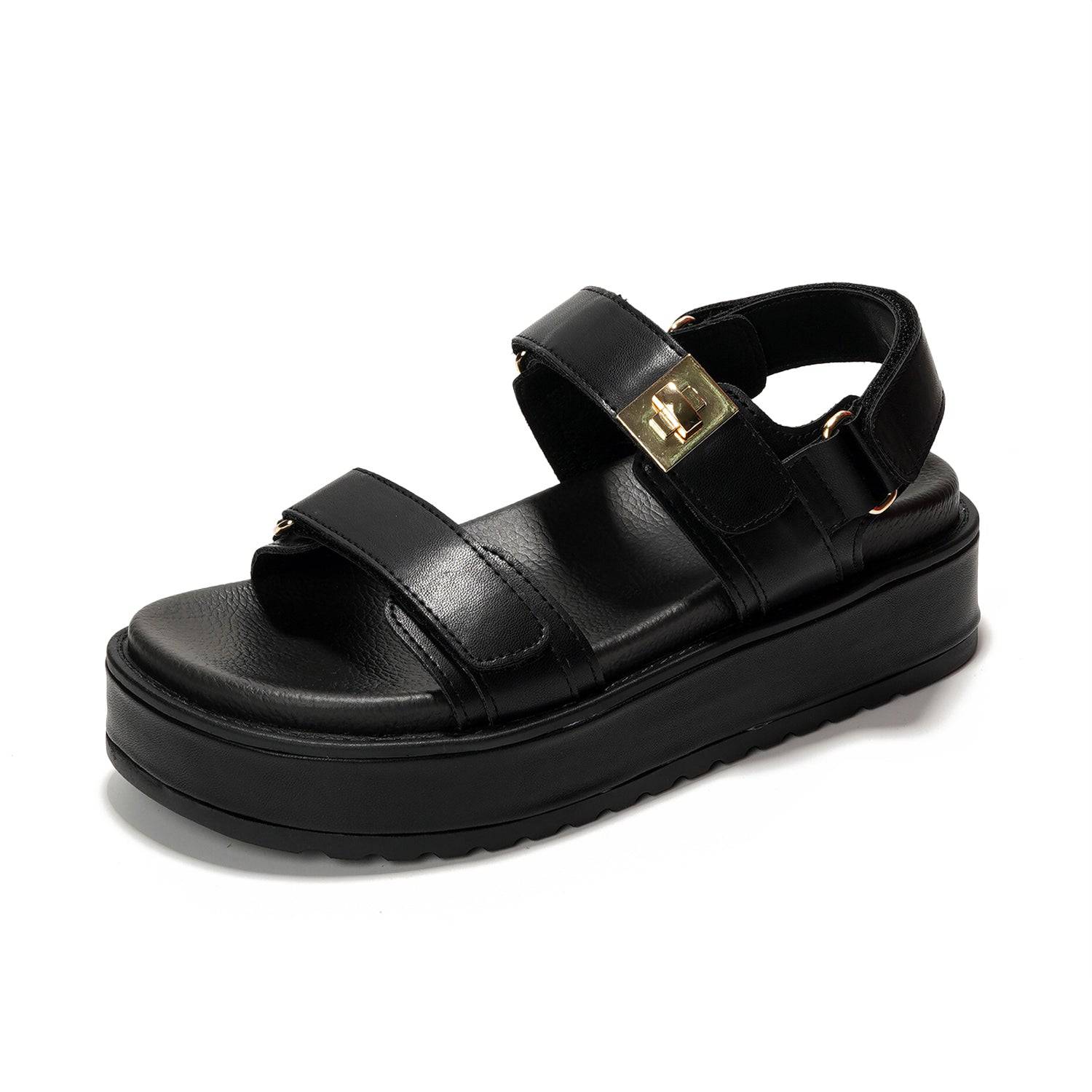 Black Ginevra flatform sandals with adjustable straps and gold buckle. Non-slip sole for summer.