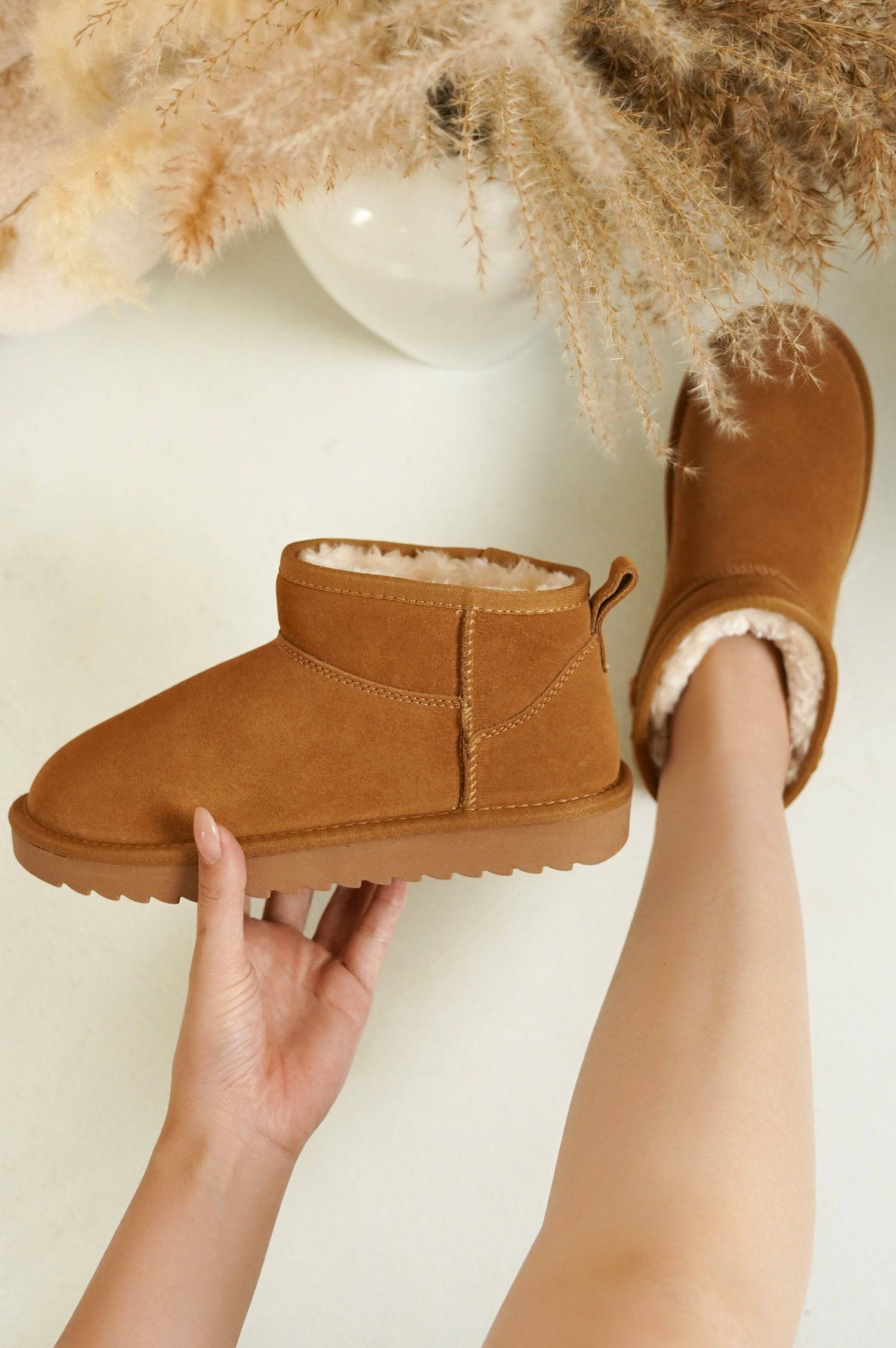 Women's brown suede Hippy ankle boot, featuring faux fur lining and water-resistant design, perfect for winter.