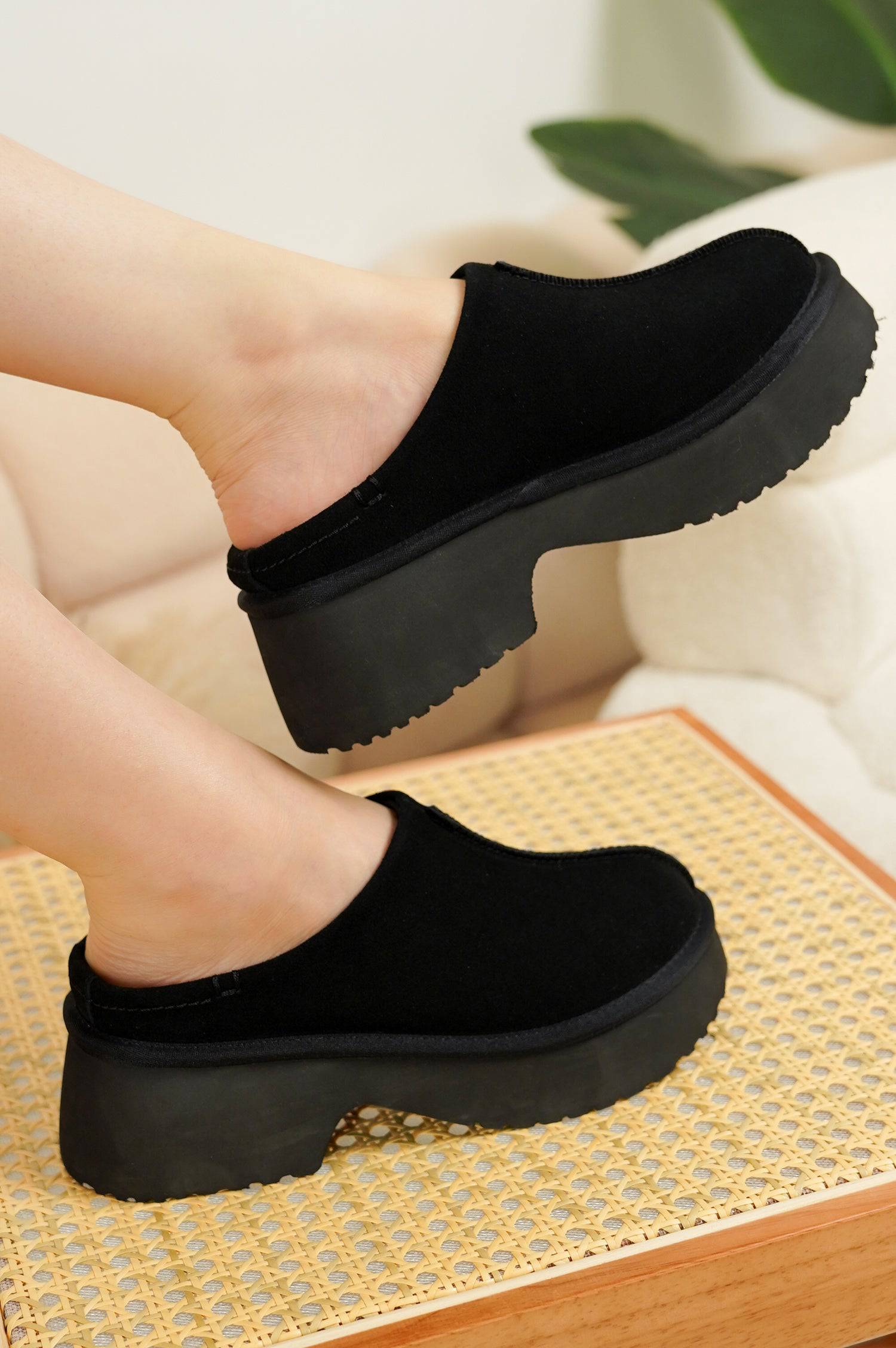 Project Cloud Johnna Suede Mules in Black. Women's slip-on cloud clogs with non-slip sole, shown on foot