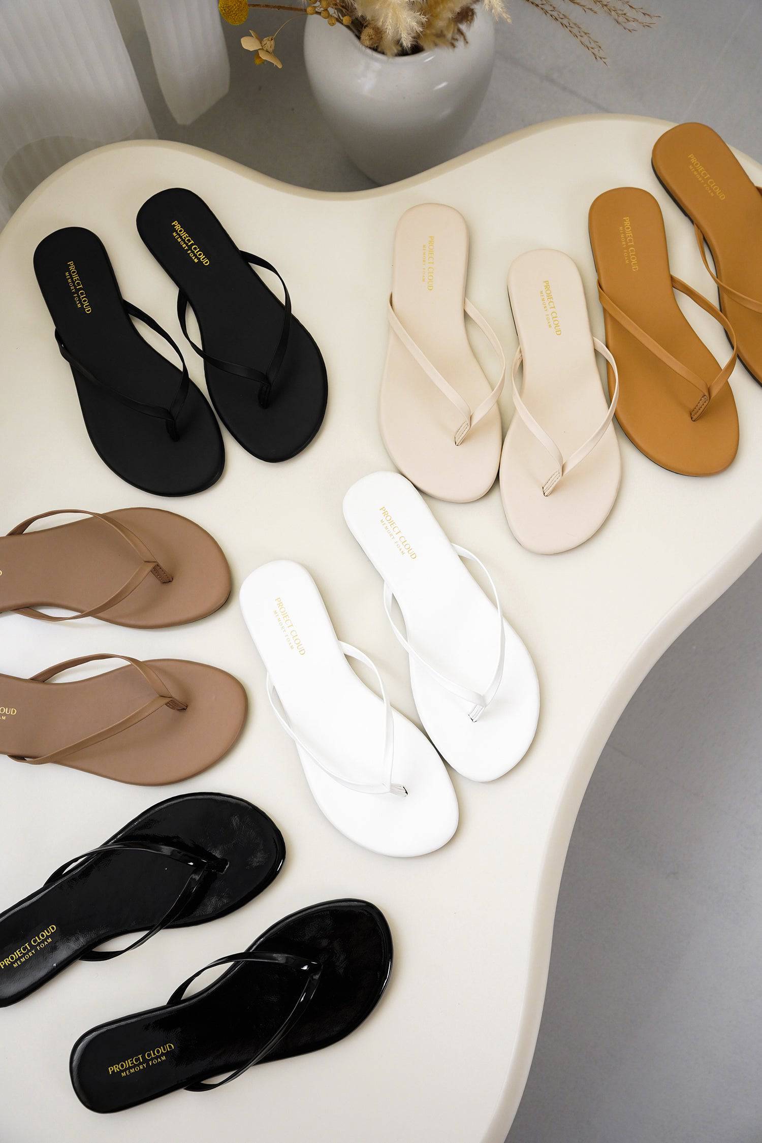 Project Cloud Women's Flip Flops in various colors. Vegan leather flat sandals with memory foam for comfortable all-day wear.
