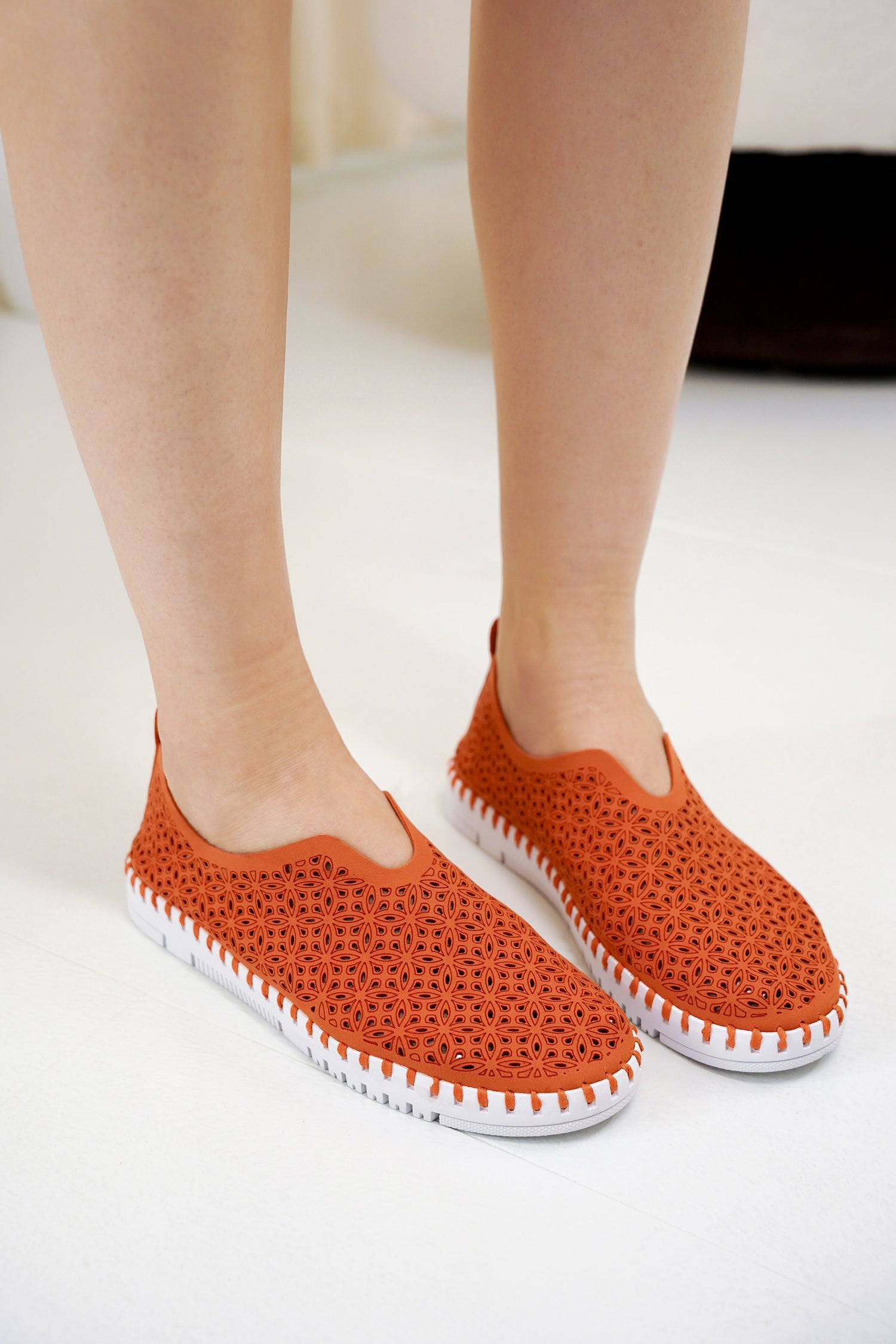 Rose orange laser-cut slip-on sneakers for women, white sole. Project Cloud's comfortable and breathable design.