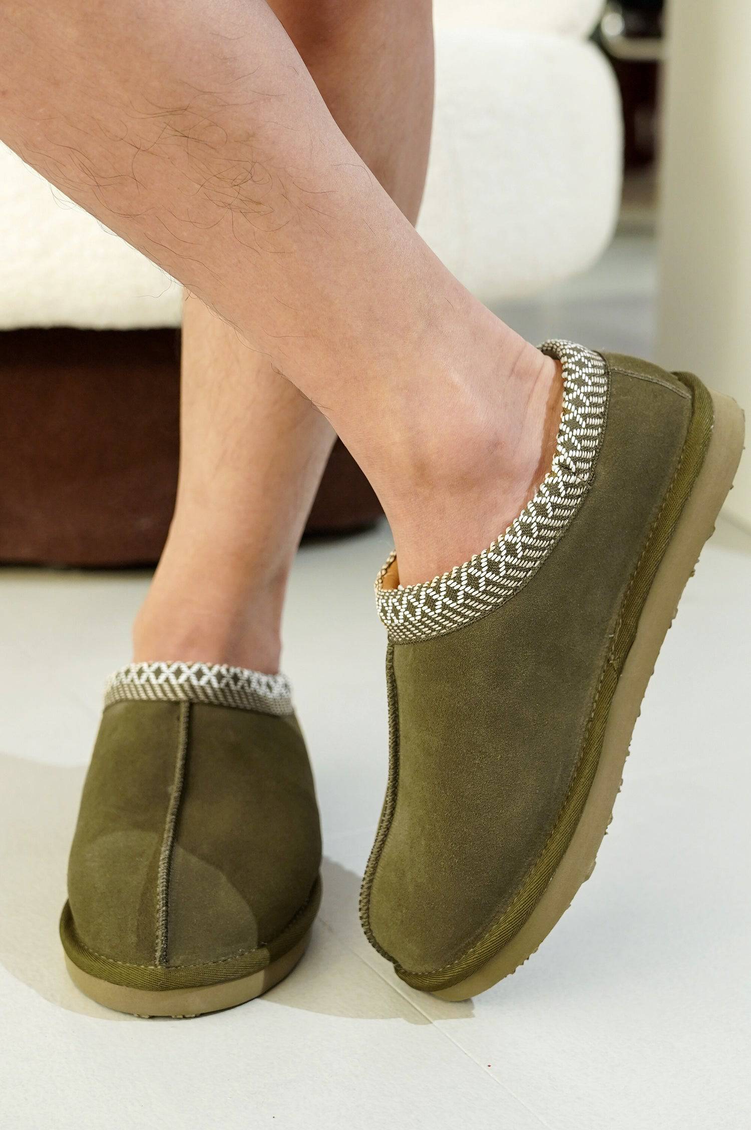 Olive green Australian sheepskin men's slippers with decorative trim, memory foam, and non-slip sole.