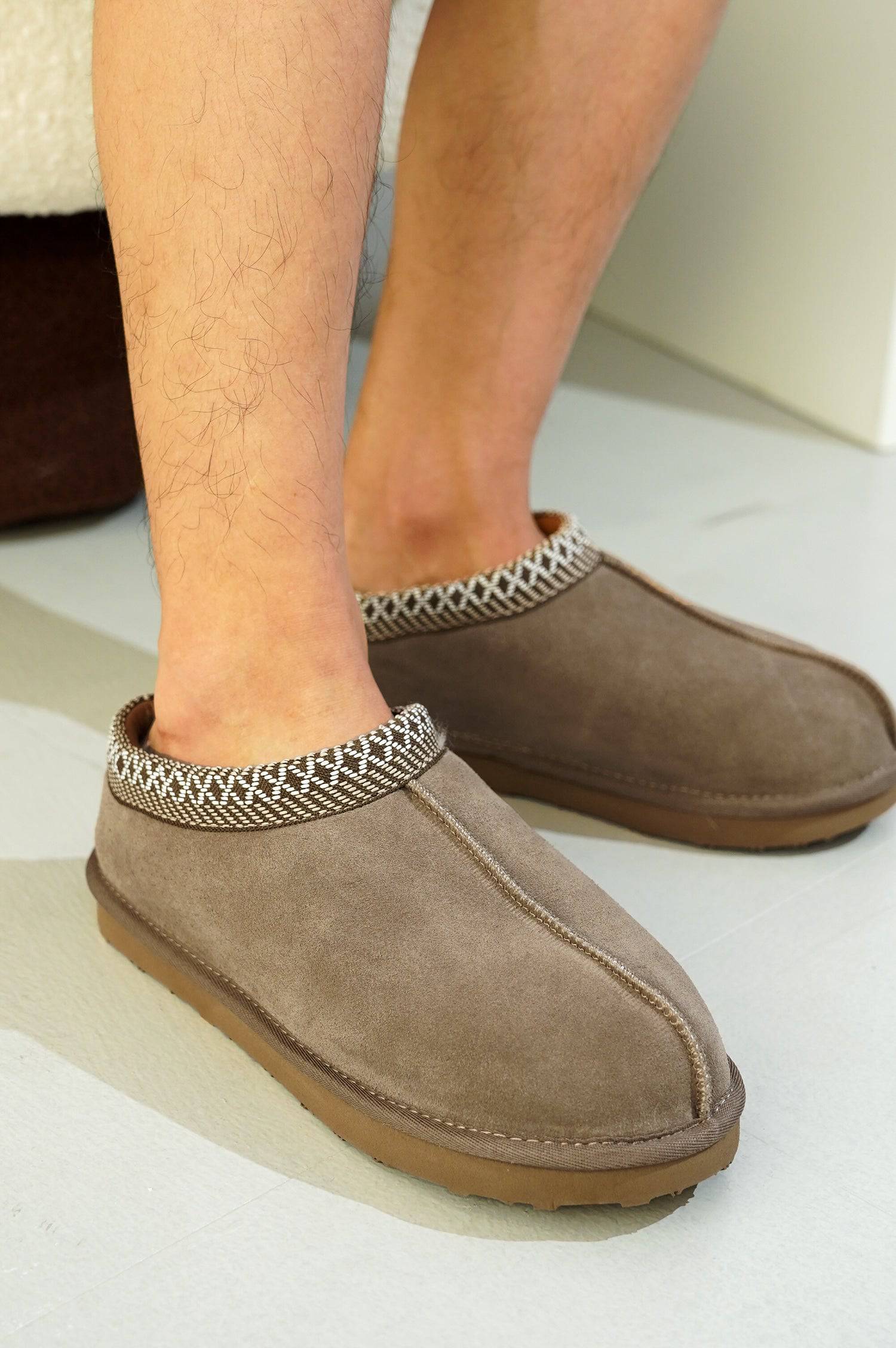 Brown suede men's Australian sheepskin slippers with decorative trim, memory foam, non-slip sole.