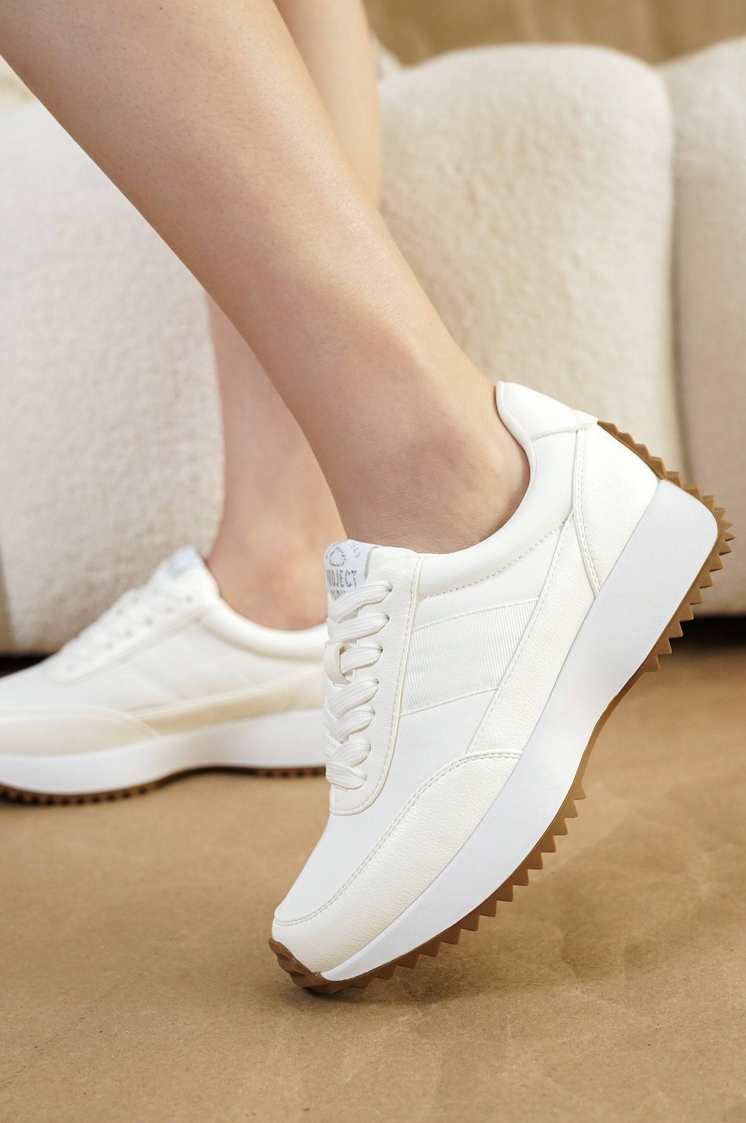 Project Cloud Serena women's white sneakers with lace-up design and brown sole, comfortable and stylish.