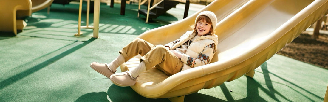 Child wearing insulated footwear to keep feet warm and comfortable during outdoor winter play.
