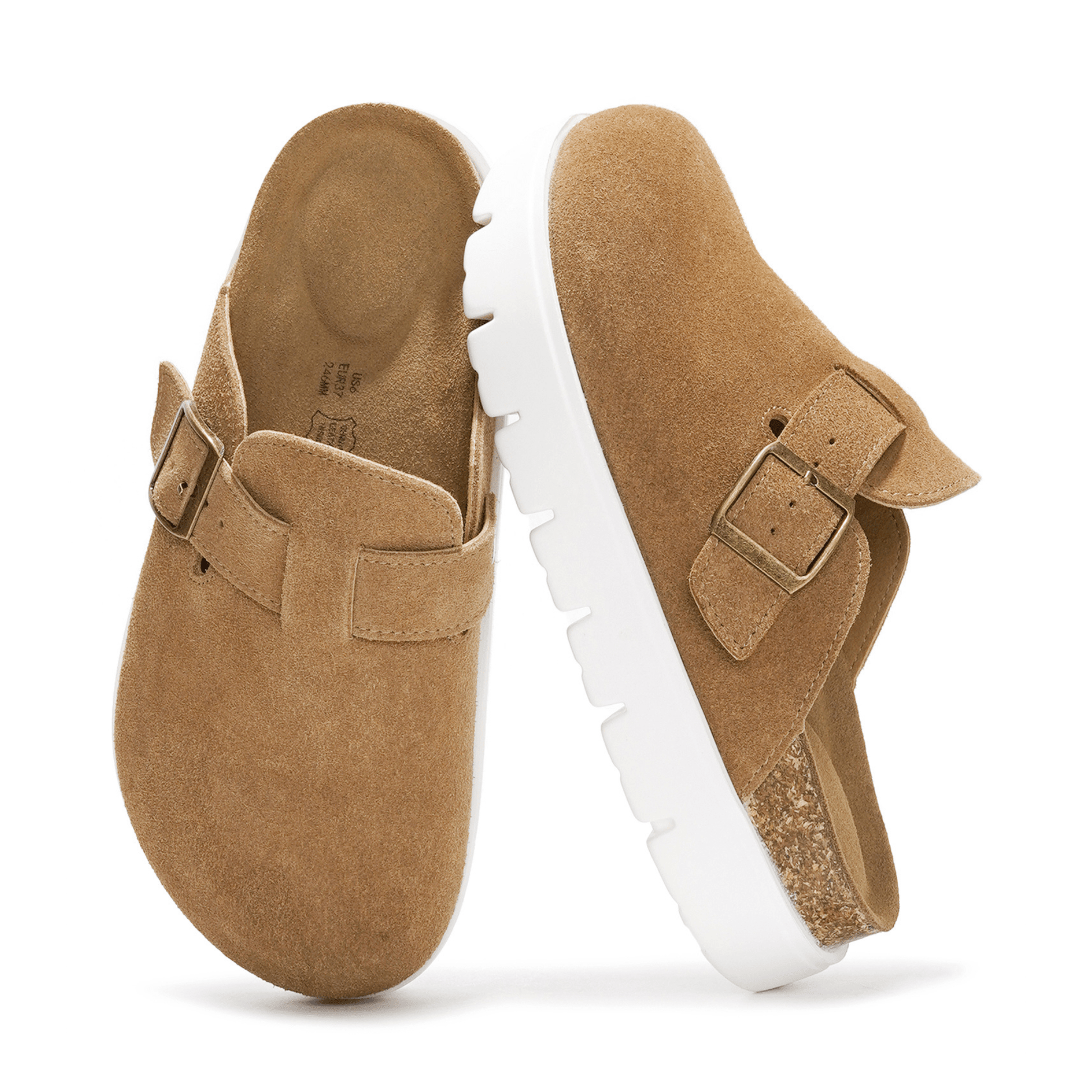 Tan suede clogs with white platform sole and buckle detail. Cork footbed for arch support.
