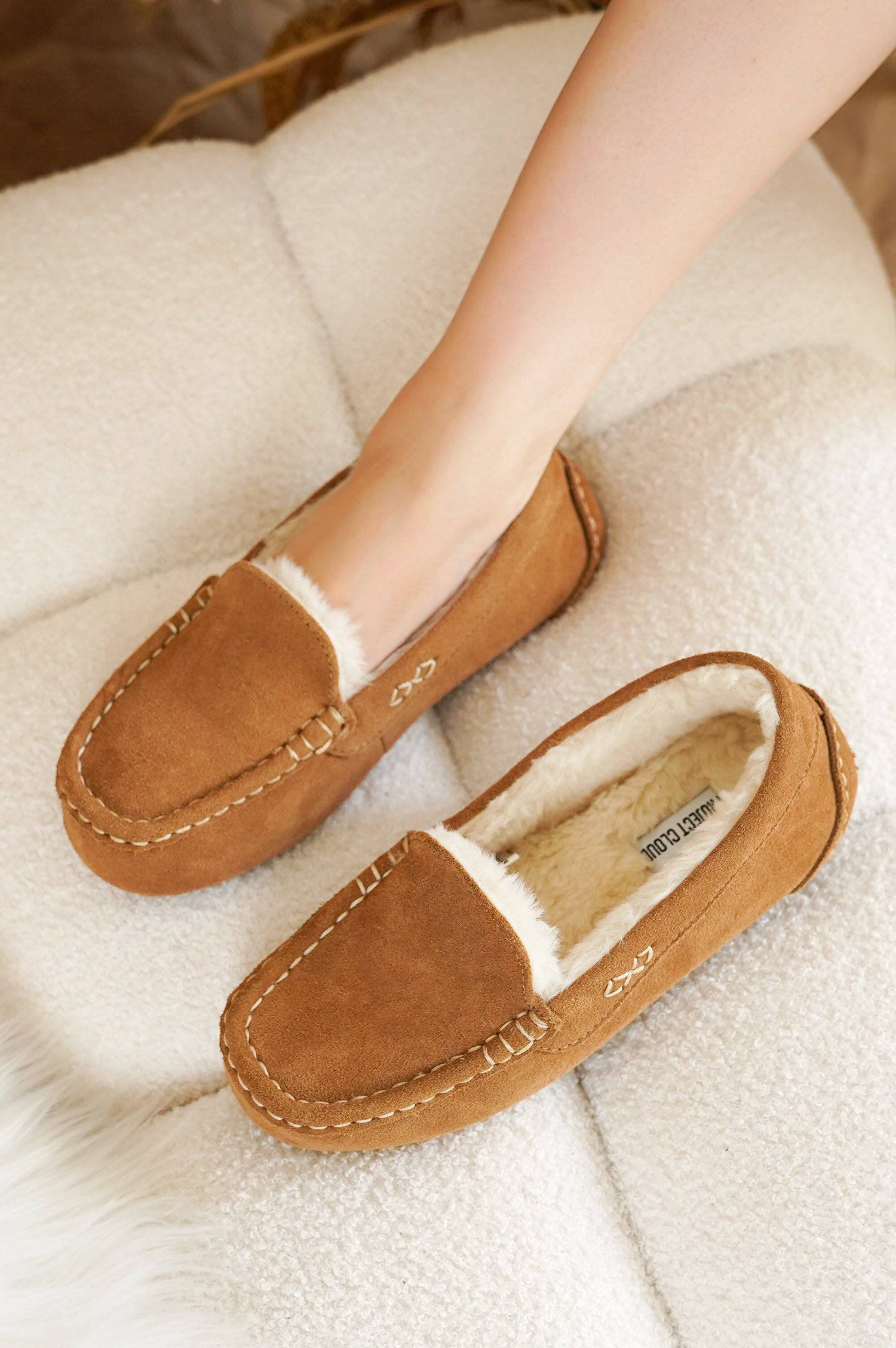 Project Cloud Brown Cathi Loafers with faux fur lining, and a person's foot.