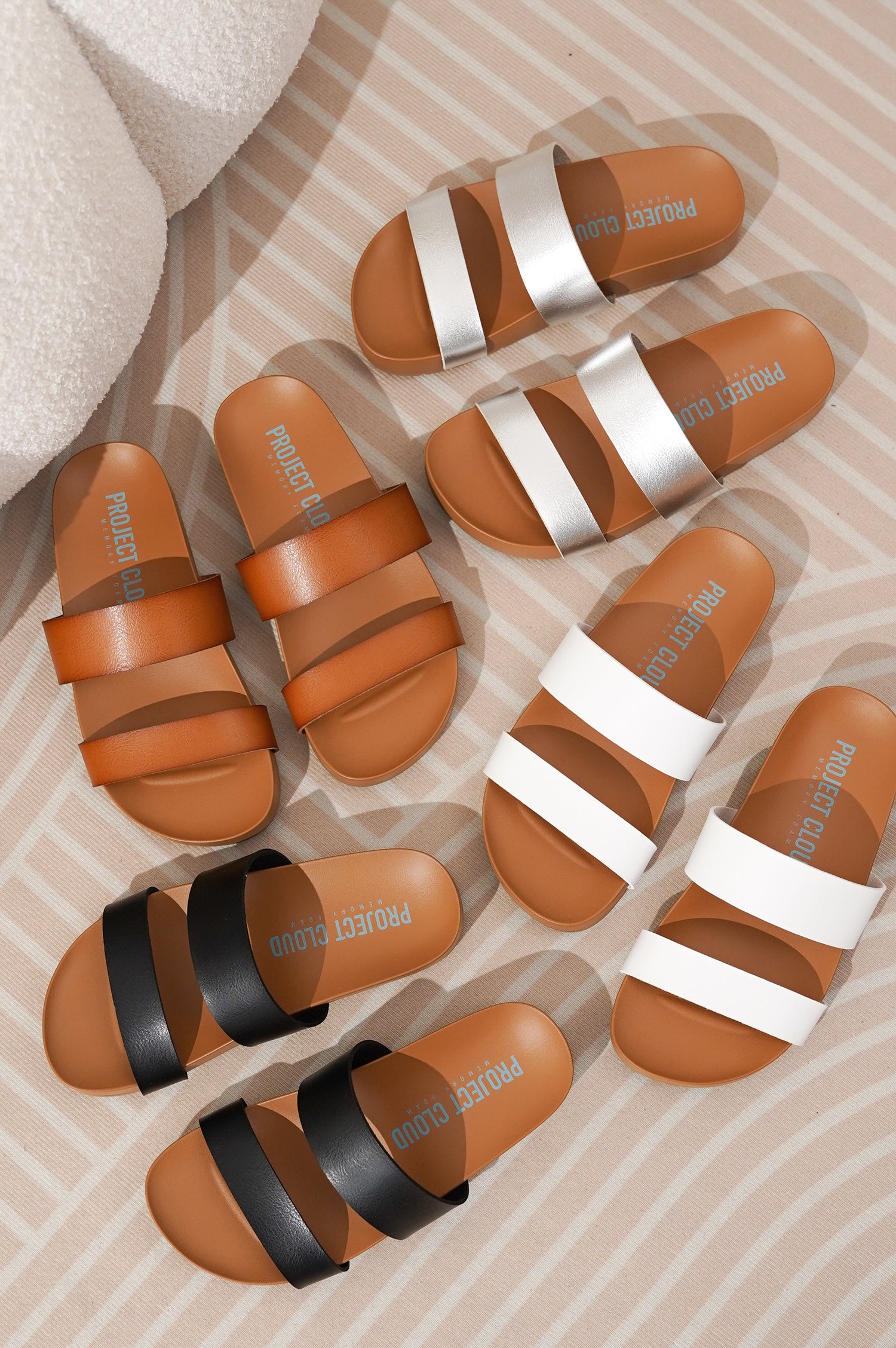 Project Cloud Hilltop sandals: eco-leather two-strap design, memory foam, in various colors.