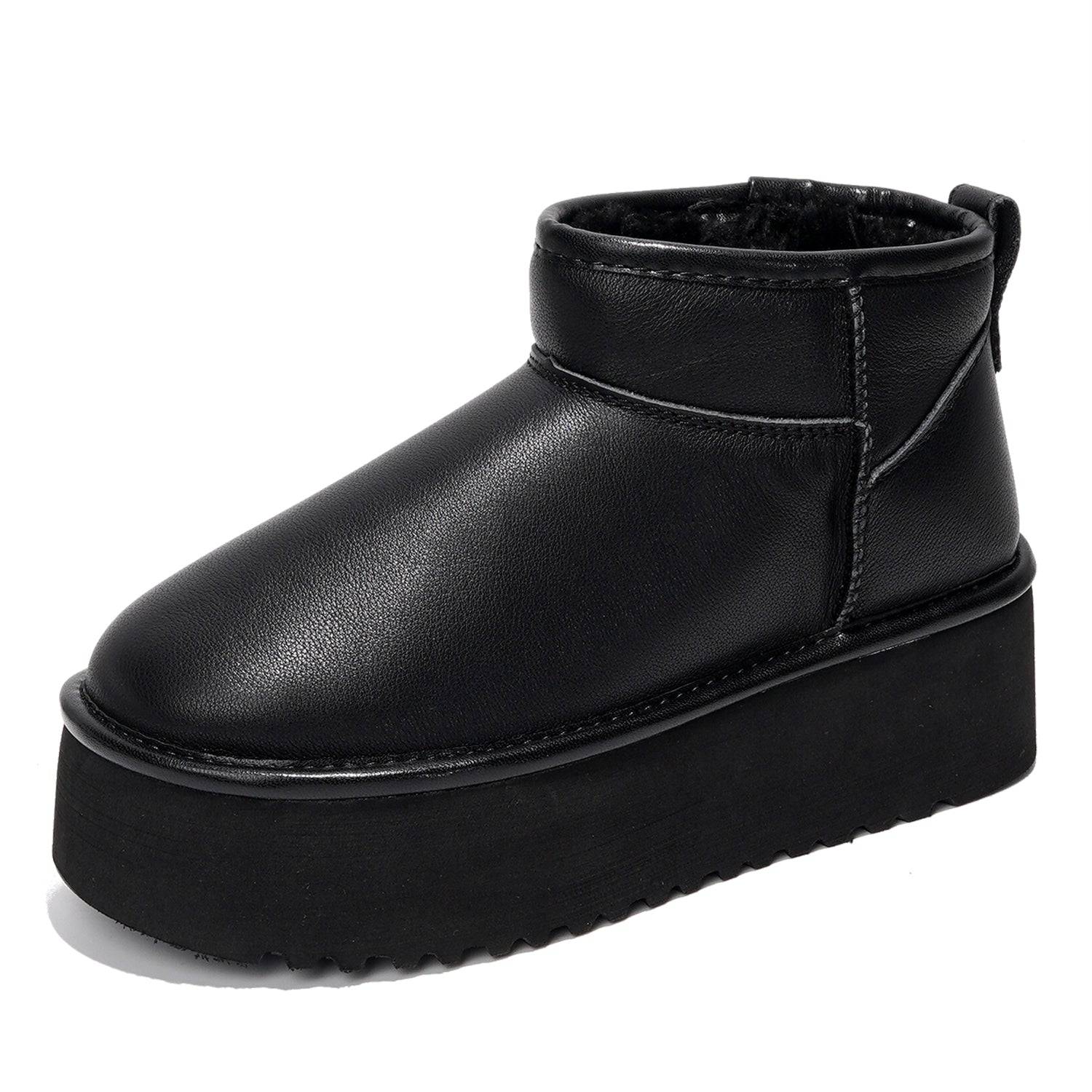 Black leather Huggy ankle boots for women with faux fur lining and platform sole. Lightweight winter boots.