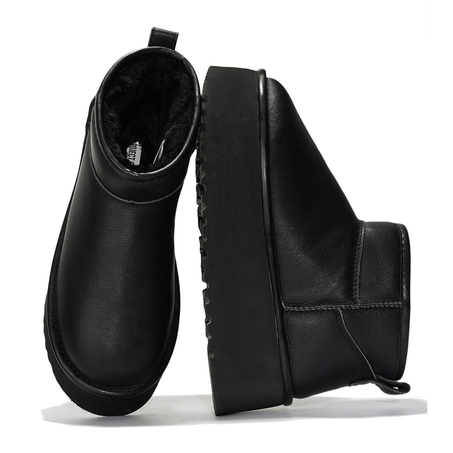 Black leather Huggy ankle boots for women with faux fur lining, platform sole, and Project label inside. Winter boots.