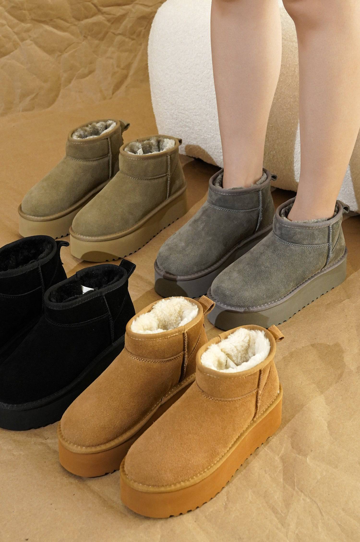 Huggy suede ankle boots for women with faux fur lining and platform soles in multiple colors. Winter boots.