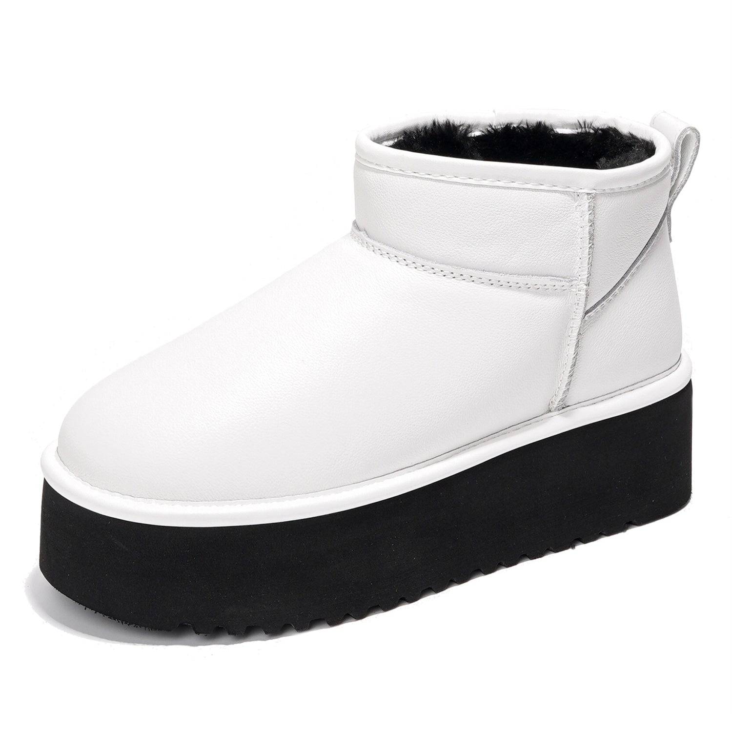 White leather Huggy ankle boots for women with black platform sole, featuring faux fur lining. Lightweight winter boots.