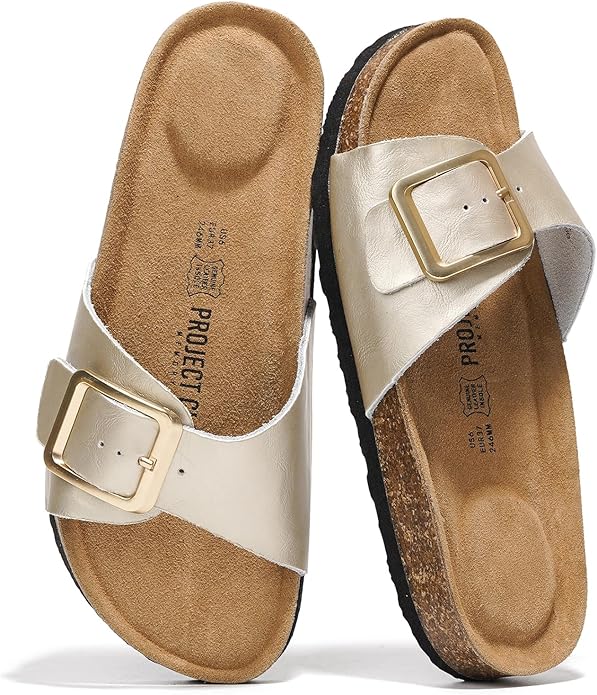 Project Cloud Ibiza gold leather sandals with buckle detail, suede insole and cork footbed. Perfect for summer.