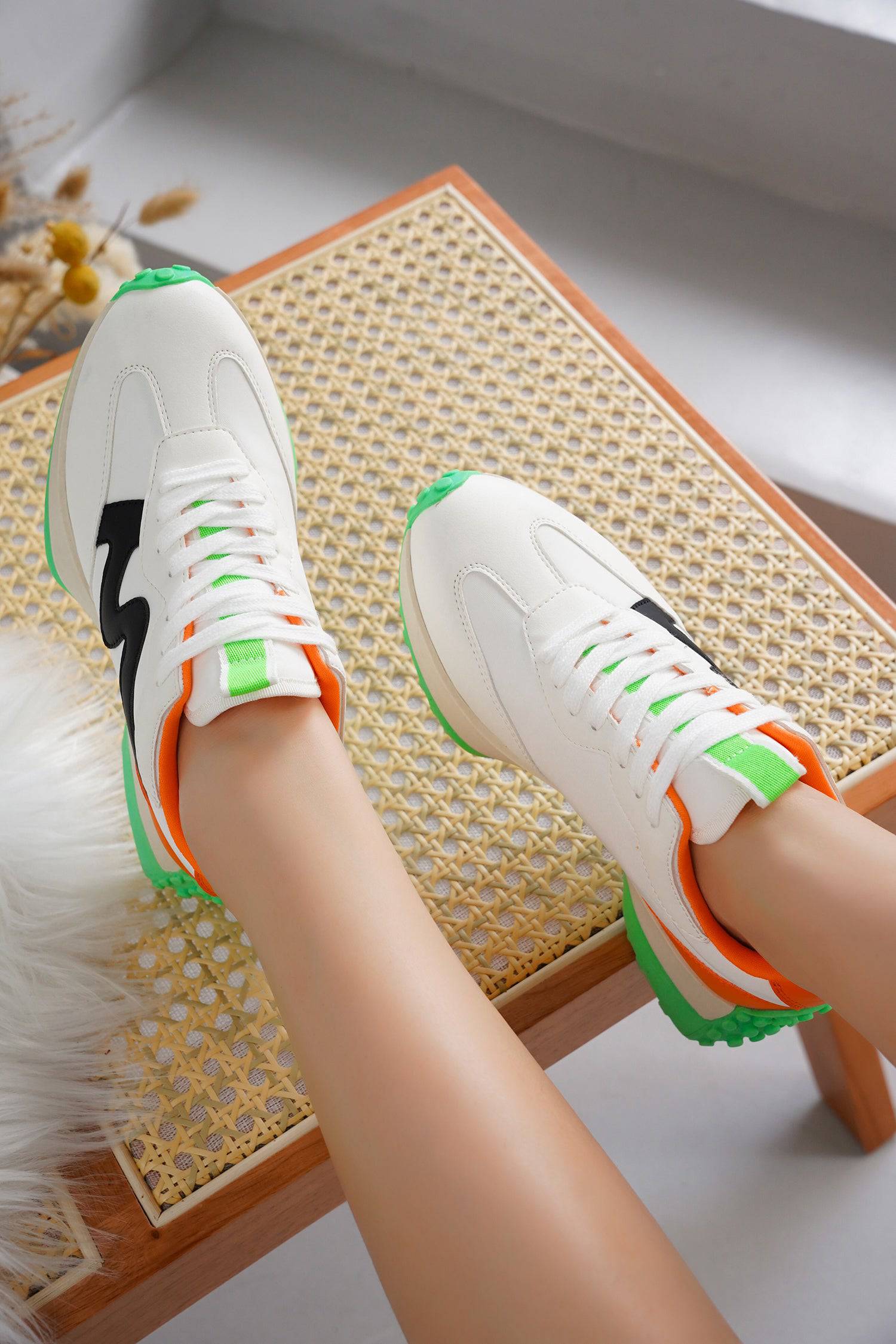 White Lecco women's sneakers with green, orange, and black accents. Memory foam, non-slip, and lace-up.