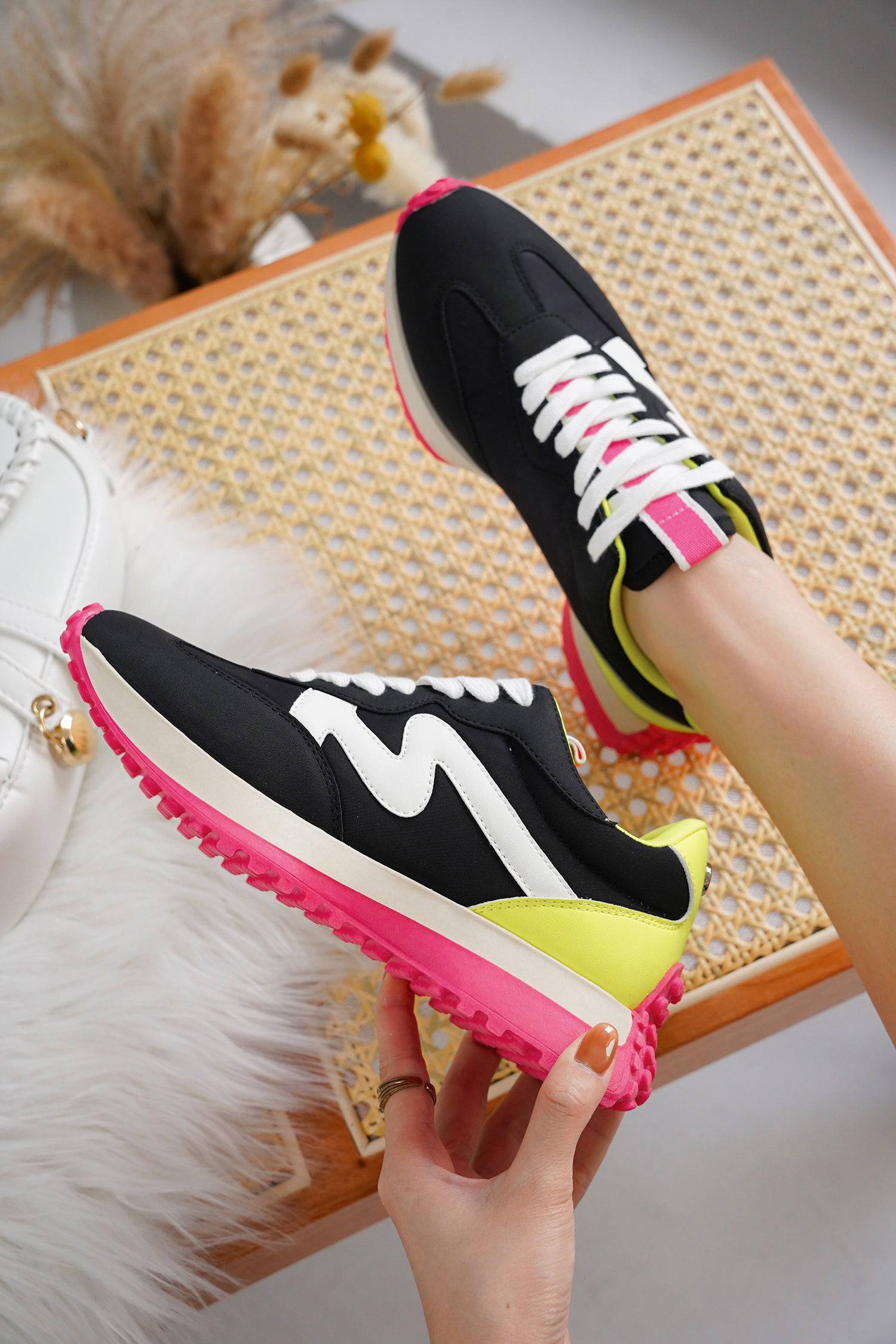 Lecco women's sneakers in black canvas with white logo, pink and yellow accents, and a non-slip sole