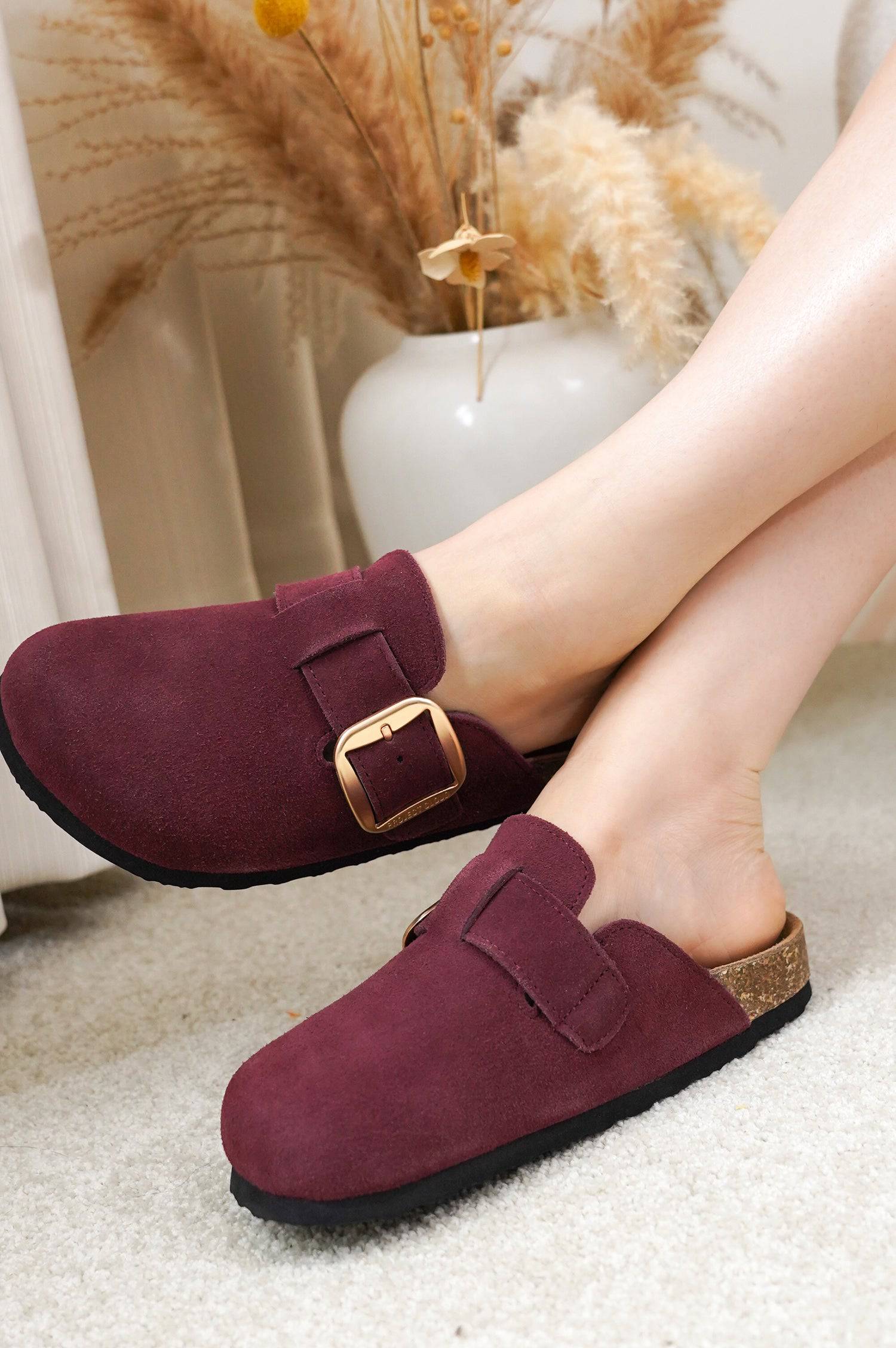 Burgundy suede Project Cloud Manchester clogs with gold buckle, showing the comfortable clog design.