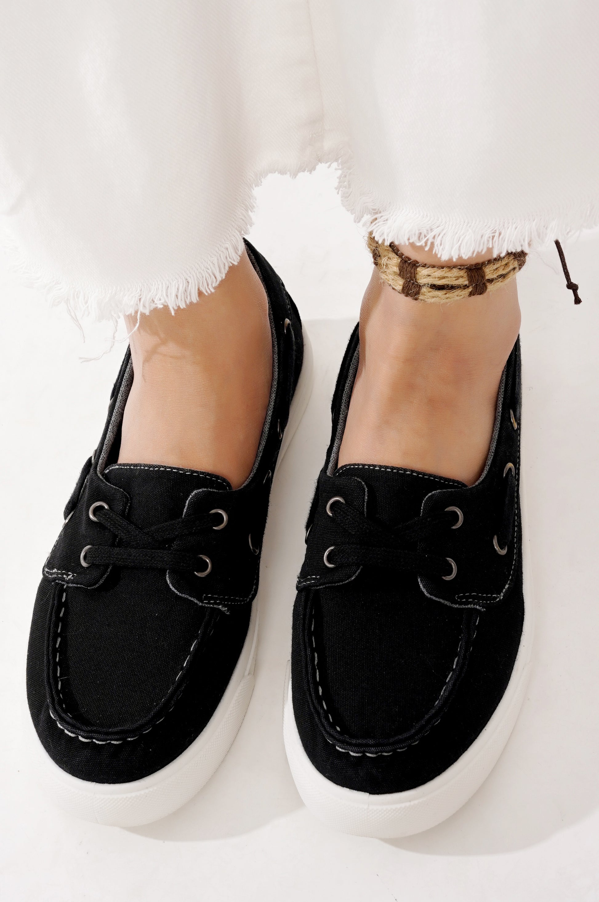 Project Cloud Seasalt black sneakers with white sole. Canvas boat shoes, comfortable and stylish design, lace-up.