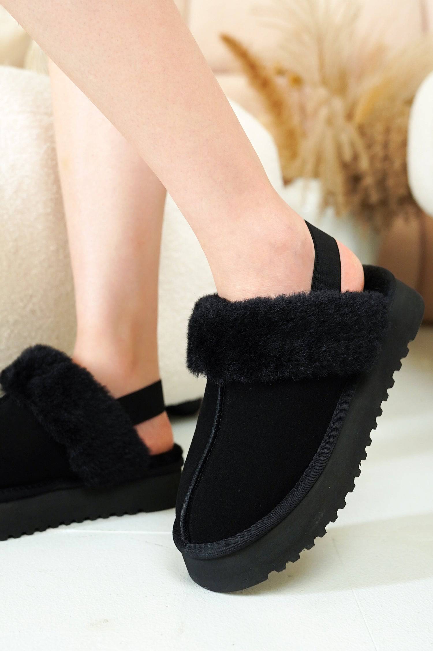 Black Slingy Suede Slippers for Women with fur lining, elastic strap, and EVA outsole, perfect for indoor & outdoor comfort.