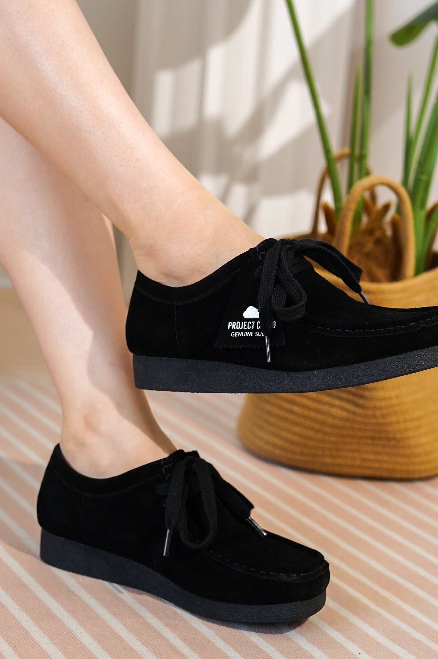 Black suede Project Cloud Wally Oxford shoes. Lace-up, memory foam, and "Genuine Suede" tag.
