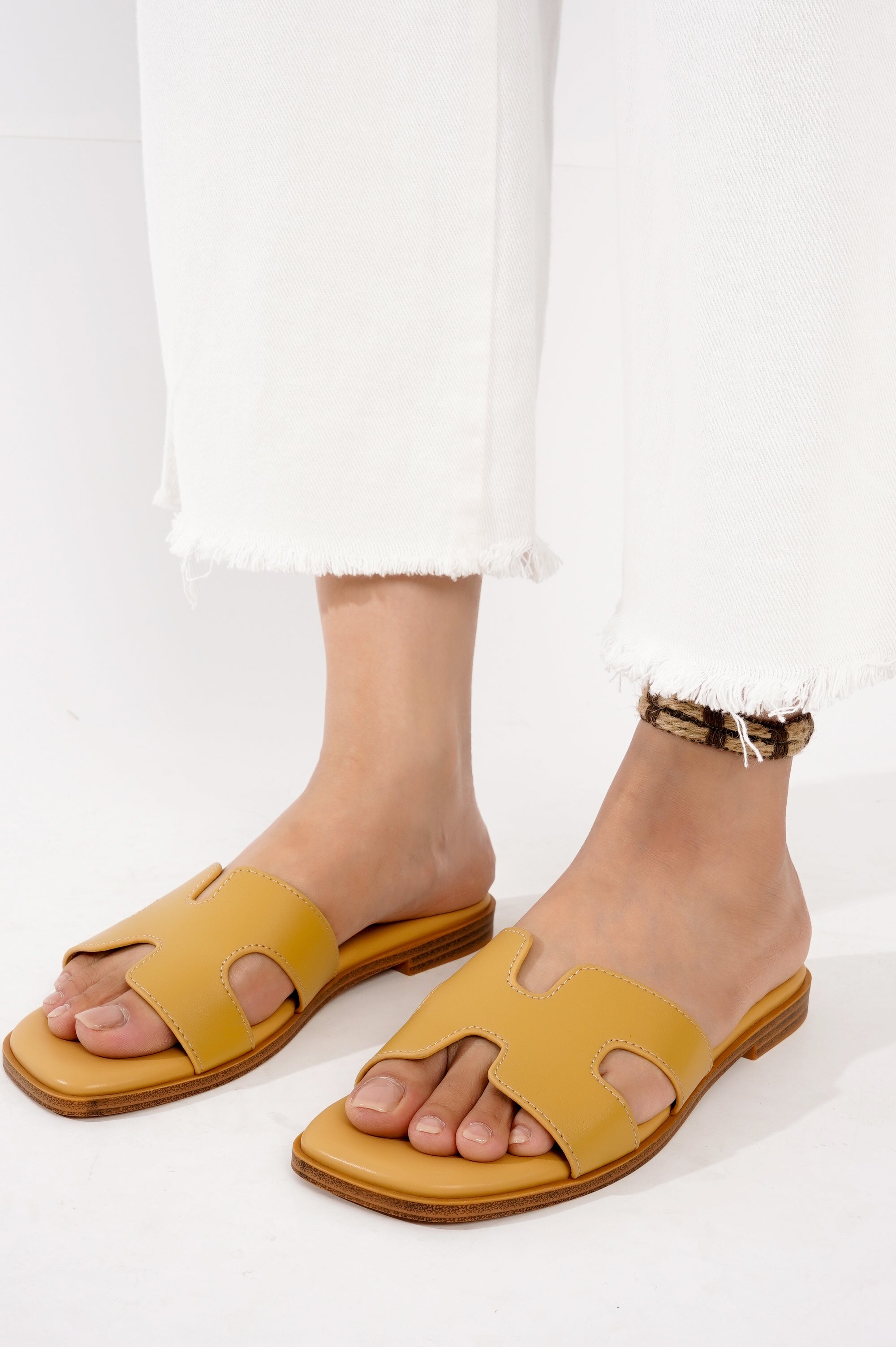 Project Cloud Jannel sandals: Yellow leather sandals with cut-out design, perfect for women's summer style and comfort
