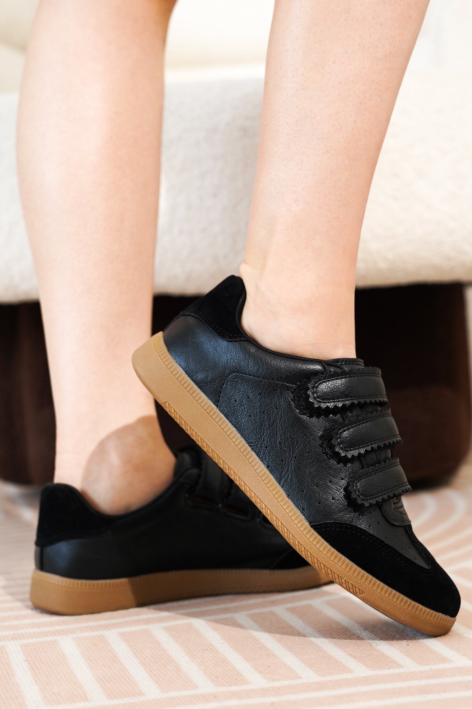 Project Cloud Ysabelle black vegan leather sneakers with velcro straps and tan sole, showcasing women's footwear.